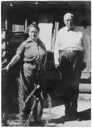 [Col. Hugh B. and Helen Moore in front of their cabin in New Mexico]