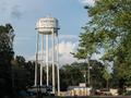 Photograph: [Water Tower and Dr. Mud's Liquor in Sour Lake, TX]