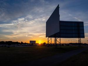 Primary view of object titled '[Drive-in Movie Theater Screens at Sunset]'.