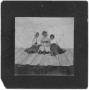 Photograph: Three Women Sitting on a Barn Roof