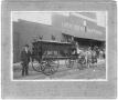 Photograph: J.P. Crouch with Hearse, at C. R. Ritenour, Livery, Feed & Sale Store
