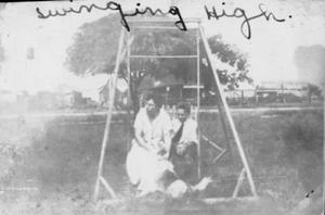[Mrs. C. A. Moers and Raymond Moers "Swinging High"]