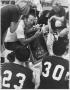 Photograph: Don Jones Coaching Girls Basketball Team in a Specific Strategy