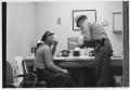 Photograph: Two Security Officers in Their Office
