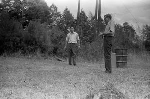 [Everett Barrilleaux and Jack Lewis Playing Horseshoes]