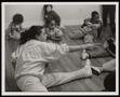 Thumbnail image of item number 1 in: '[Buffy Landry Stretching with Children]'.