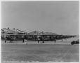 Photograph: Ships on Line - Basic Stage [Planes Lined Up in Front of Hangars]