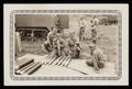 Photograph: [Soldiers Posing with Artillery Shells]