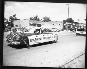 Primary view of object titled '[Boerne Shooting Club Car in Parade]'.
