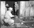 Thumbnail image of item number 1 in: '[Men and Boy in Wooden Structure]'.