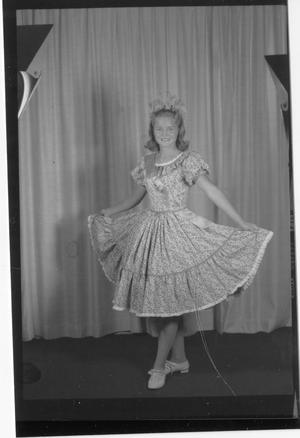 [Betty Schmidt Posing in Front of Curtain]