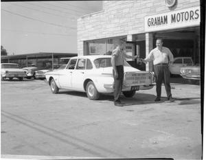 Primary view of object titled '[Driver's Ed Car Outside Graham Motors]'.