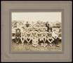 Photograph: [Football team seated on bleachers]
