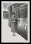 Thumbnail image of item number 1 in: '[Sheila Emery Allen standing in snow next to storefront window]'.