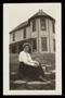 Primary view of [Annie Belle Emery Bright seated in front of Allen house on Heaton Avenue in Fort Worth]