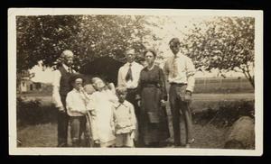 [Group photo outdoors with elderly Uncle Rollin and Aunt Dollie Stirman]