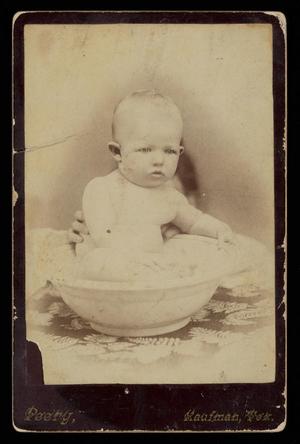 [Stirman infant in bowl with hidden mother holding him upright]