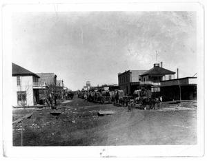 Main Street with cotton wagons