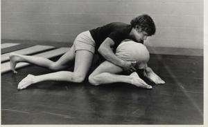 Primary view of object titled 'Two TCJC Students Wrestling in the Gym'.