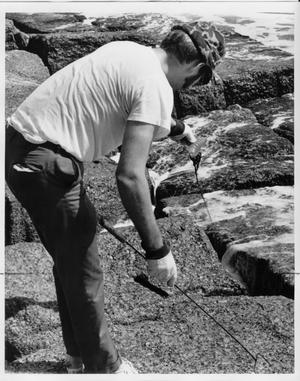 Primary view of object titled 'Geology Student Probing for an Object'.