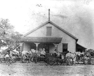 Primary view of object titled '[Buggies with Horses at a Round Rock Cheese Factory]'.