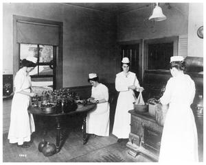 Primary view of object titled '[Female Students in a Kitchen]'.