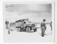 Photograph: [Servicemen Offloading a Truck from a Higgins Boat Onshore]