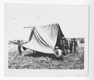 [Servicemen Setting Up Tent]