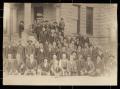 Photograph: Group of Early Denton County Settlers Sitting on Courthouse Steps