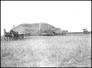 Primary view of object titled '[Threshing crew and wagons]'.