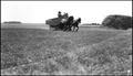 Photograph: [Farm wagon in a field]