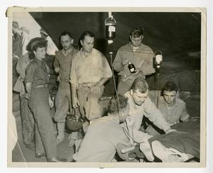 [Jane Kendeigh and Others Overseeing a Wounded Solider]