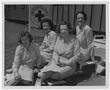 Primary view of [Red Cross Staff Sit in Front of Fleet Hospital]