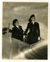 Thumbnail image of item number 1 in: '[Lorna Lose & Judy Fuller Standing in Plane Cockpit]'.