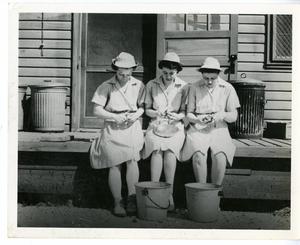 [Members of the Women's Auxiliary Corps Peeling Potatoes]