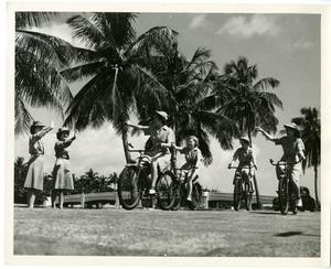 [Members of the Women's Auxiliary Corps Riding Bicycles]