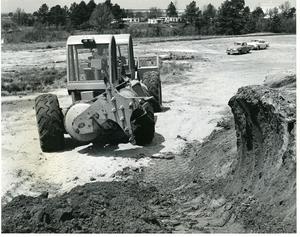 Primary view of object titled 'A digging machine that can dig its way right up a straight bank J5G, Photo 16, L-7399'.