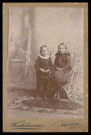[Portrait of Two Unknown Children in a Wicker Chair]