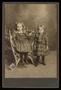 Photograph: [Portrait of Two Unknown Girls in Plaid Dresses]