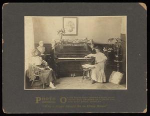 [Women with a Thos. Goggan & Bros Piano]