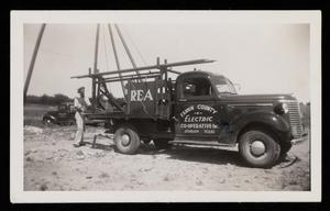 Primary view of object titled '[Fannin County Electric, Installing a Power Line]'.