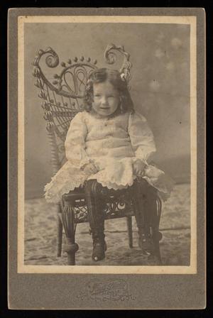 [Portrait of a Child on a Wicker Chair]