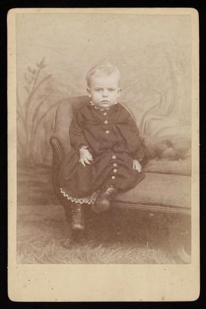 [Portrait of an Unknown Child Sitting on a Sofa]