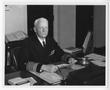Photograph: [Fleet Admiral Chester W. Nimitz Sits at His Desk]