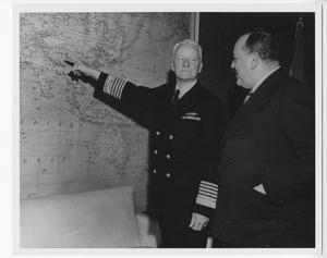 [Fleet Admiral Chester W. Nimitz Points At a Map]