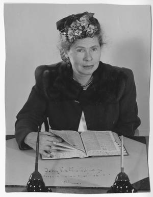 Primary view of object titled '[Catherine Freeman Nimitz Sits at Desk]'.