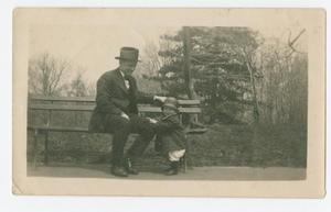 [Chester W. Nimitz Sits on Bench with Child]