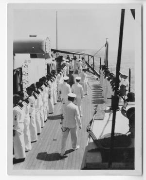 [Enlisted U.S. Navy Men as U.S. Naval Officers Walk By]