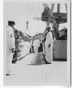 Primary view of object titled '[Captain Chester W. Nimitz Walking Between Two Rows of Enlisted U.S. Navy Men]'.