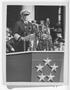 Photograph: [Fleet Admiral Chester W. Nimitz Speaking at Welcome Home Parade]